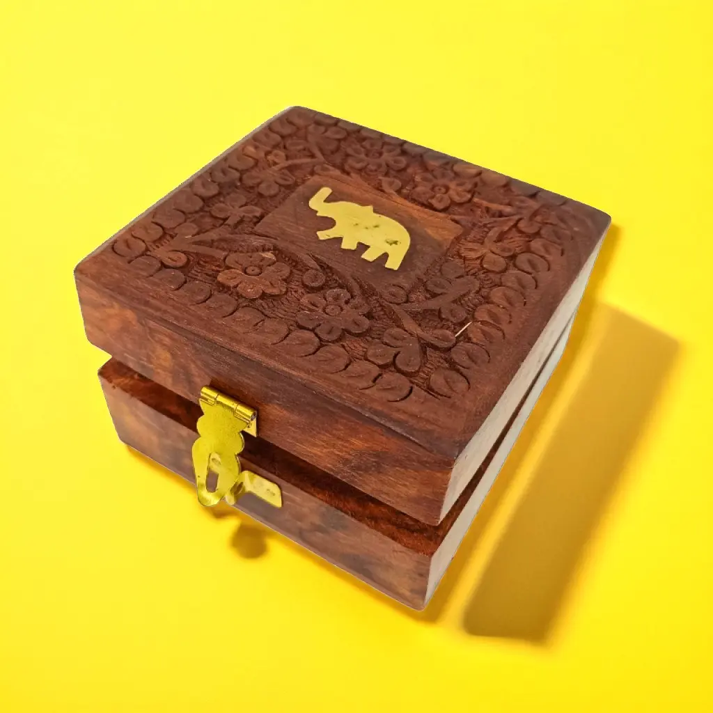 JZ-BX0002 (0) Product Feature Details Product Type Handmade Wooden Storage Box Design Elephant Design Brass Inlay Origin India Craftsmanship Nakkashi - Traditional Indian Technique Material Fabric, Metal, Wood Dimensions Length: 4", Width: 4", Height: 2" Use Jewelry or Keepsake Storage